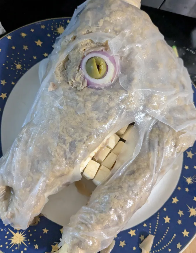 It's a horrible vegan goat head with rice paper and seitan flesh.